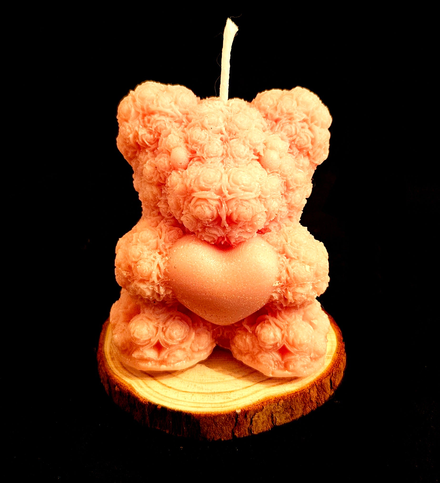 A charming handmade teddy bear crafted from flowers.