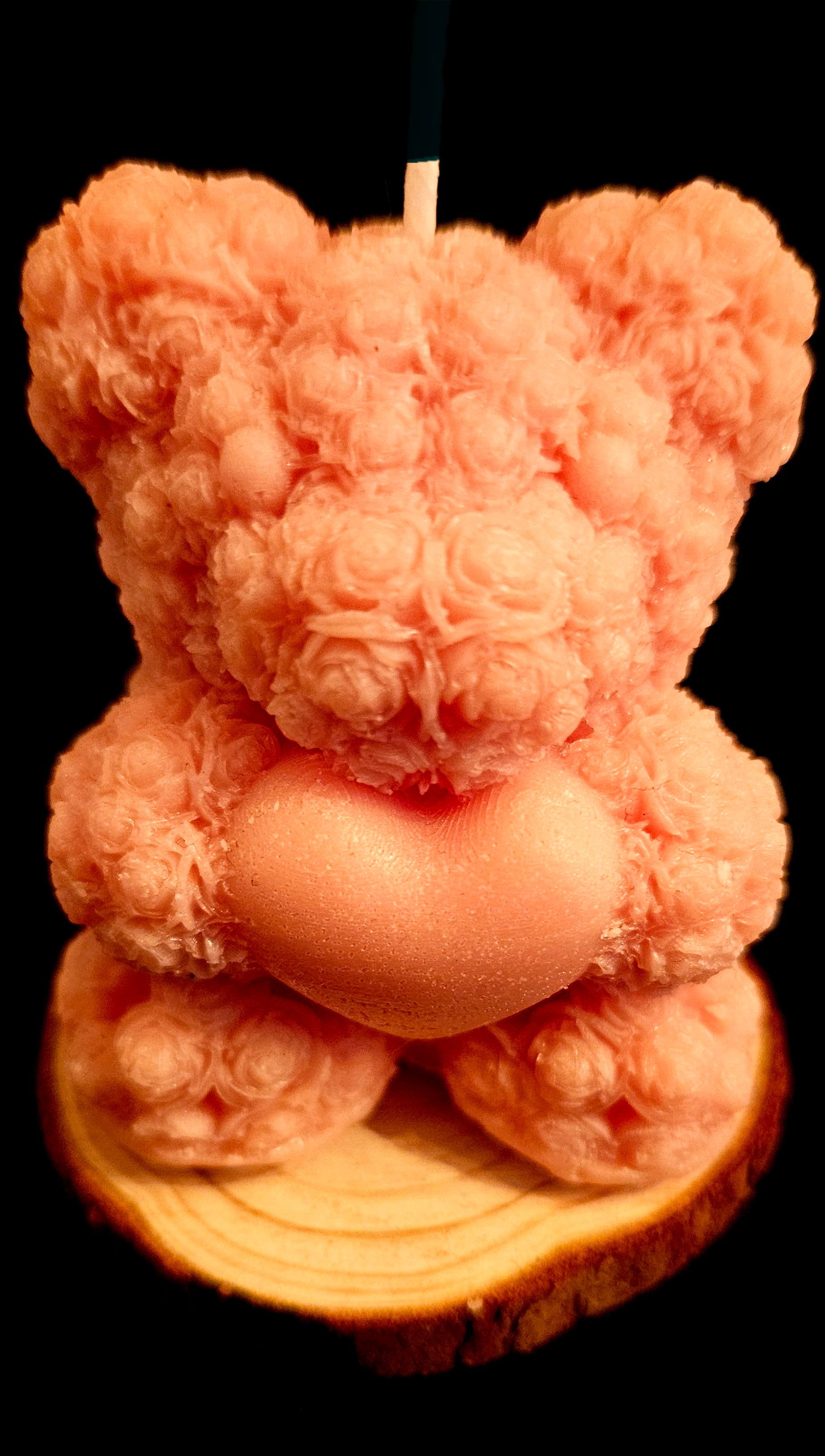 A charming handmade teddy bear crafted from flowers.