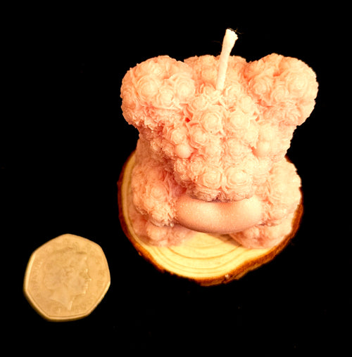 A charming handmade teddy bear crafted from flowers.