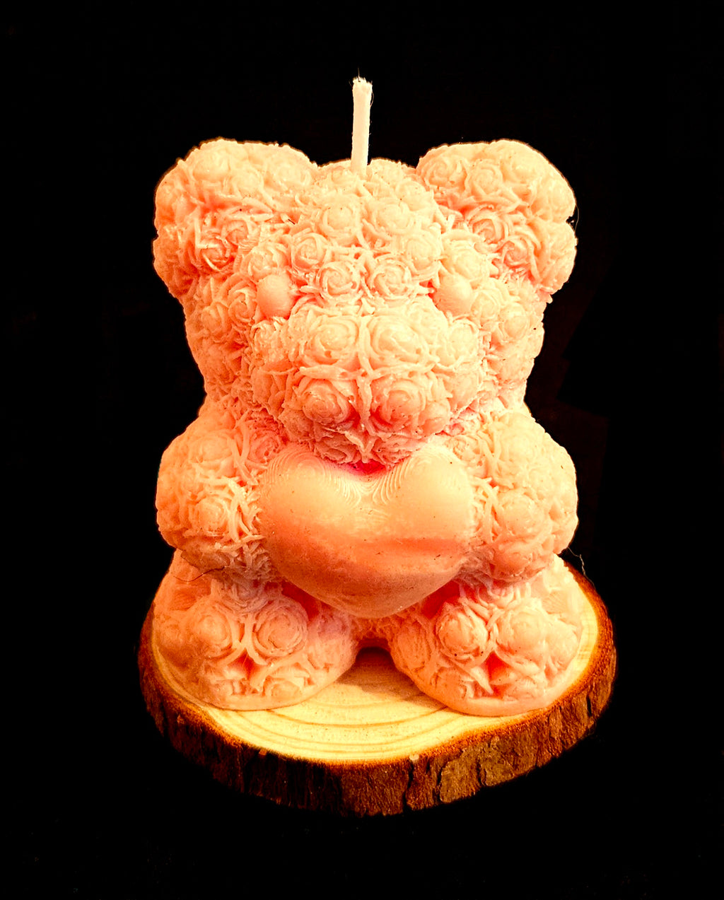 A charming handmade teddy bear crafted from flowers.