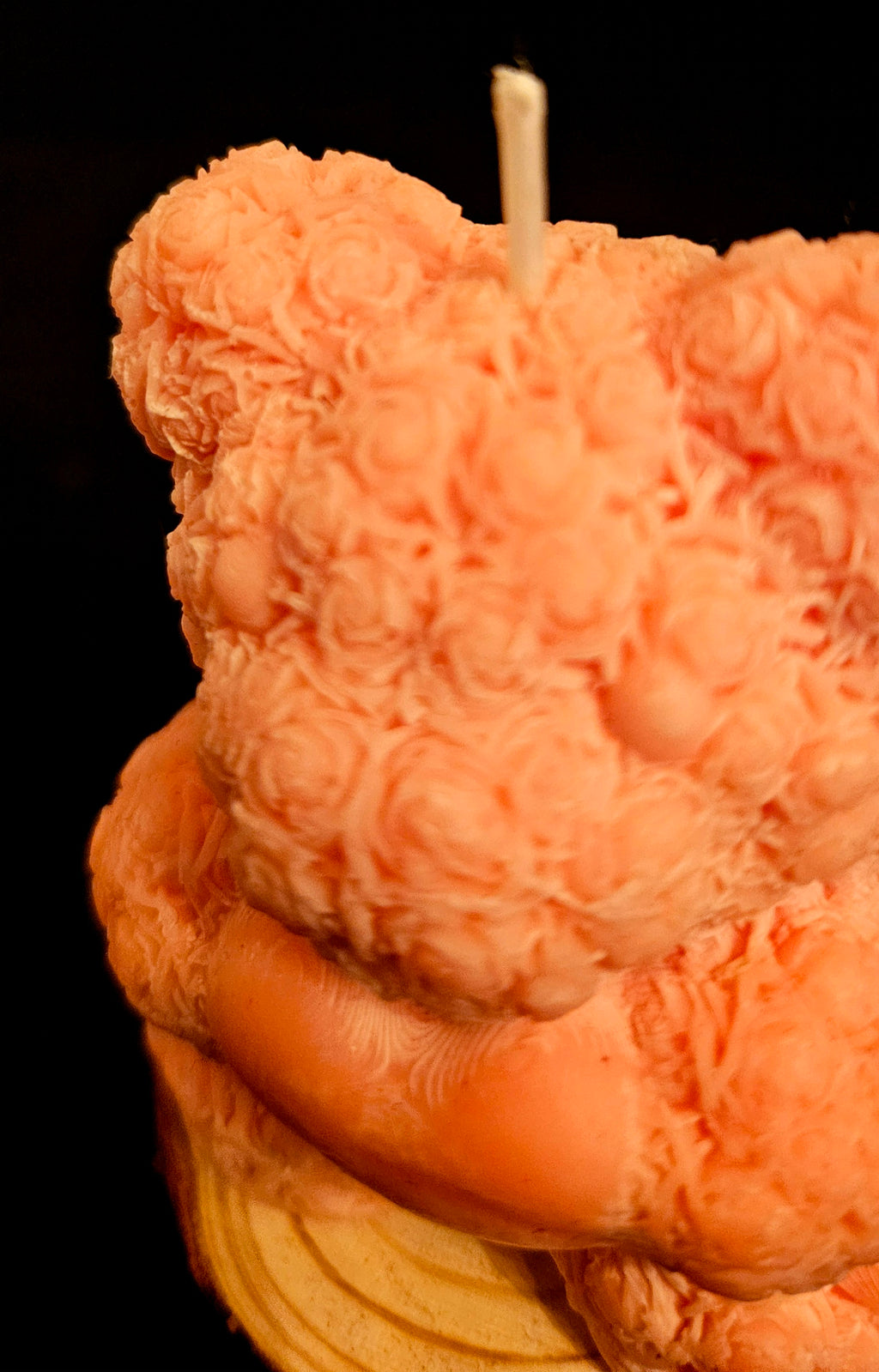 A charming handmade teddy bear crafted from flowers.