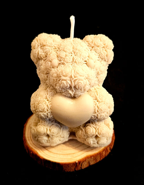 A charming handmade teddy bear crafted from flowers.