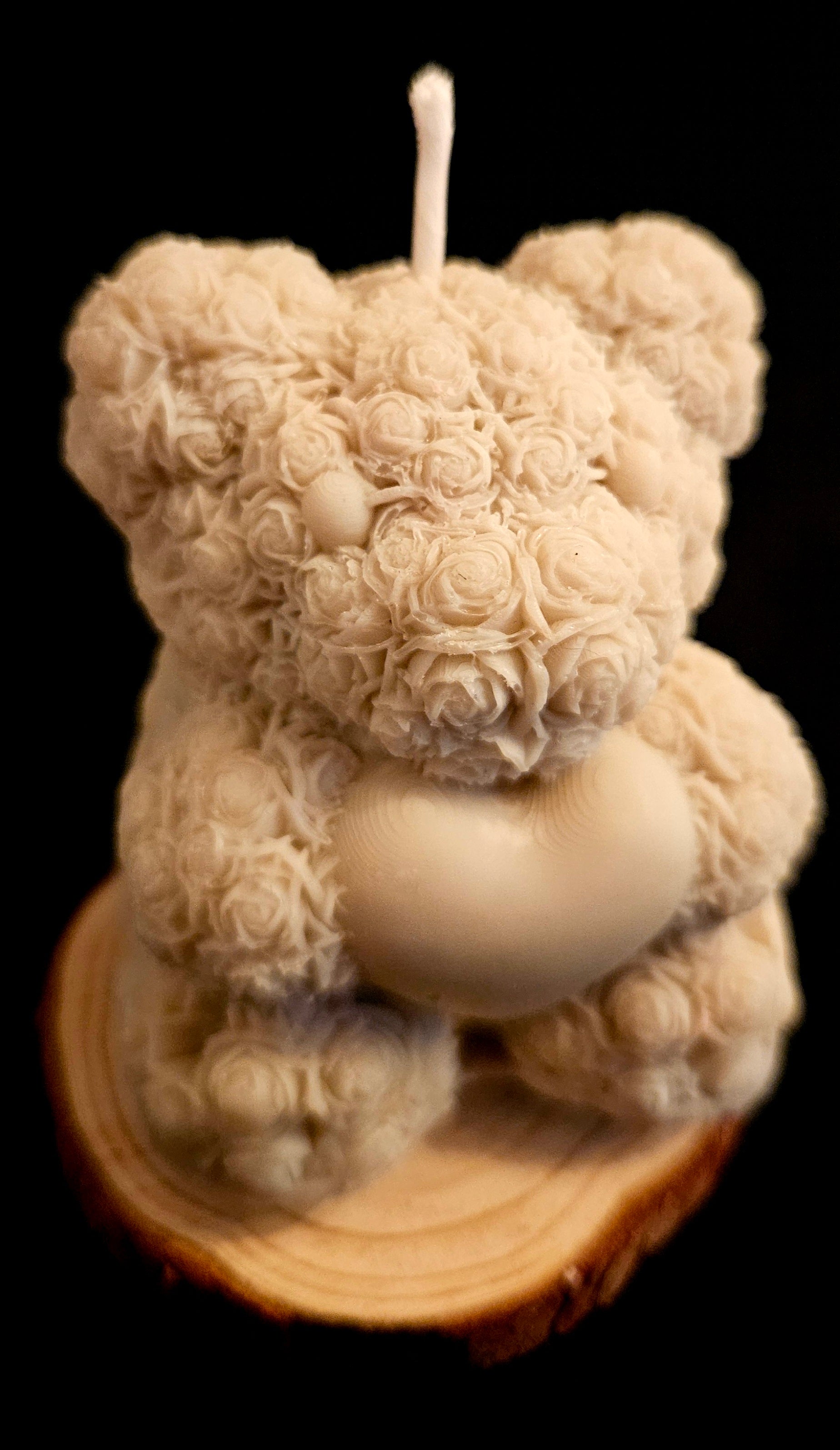 A charming handmade teddy bear crafted from flowers.