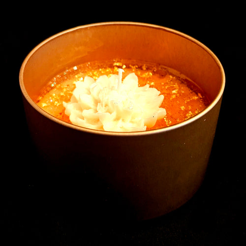 A delicately crafted, charming white flower candle.