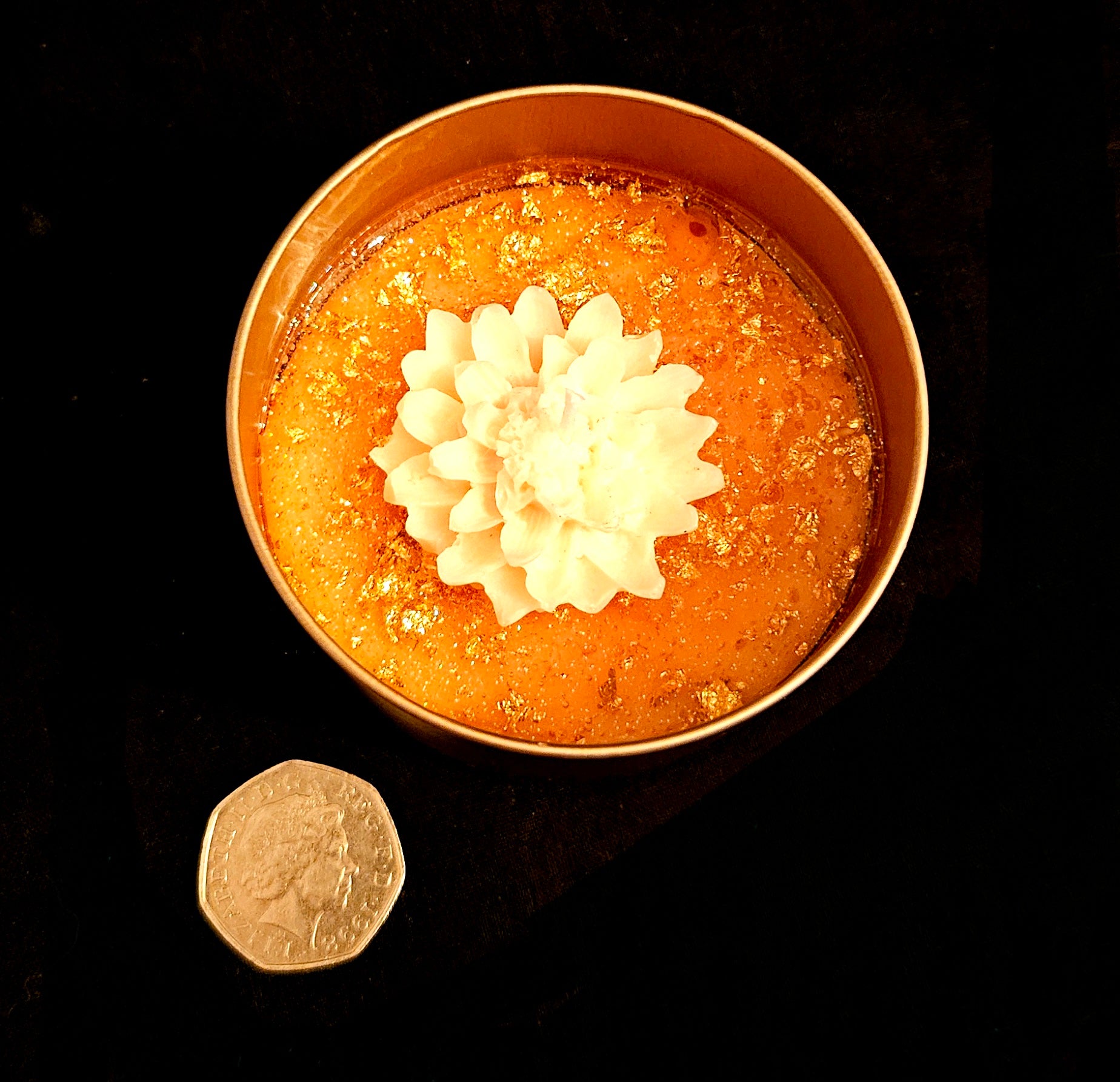 A delicately crafted, charming white flower candle.