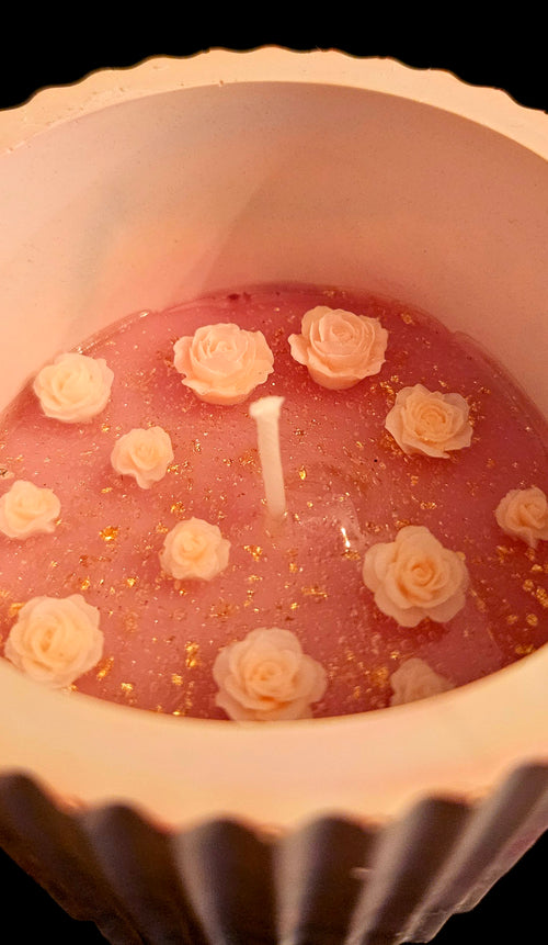 A delicately crafted, miniature floral candle.